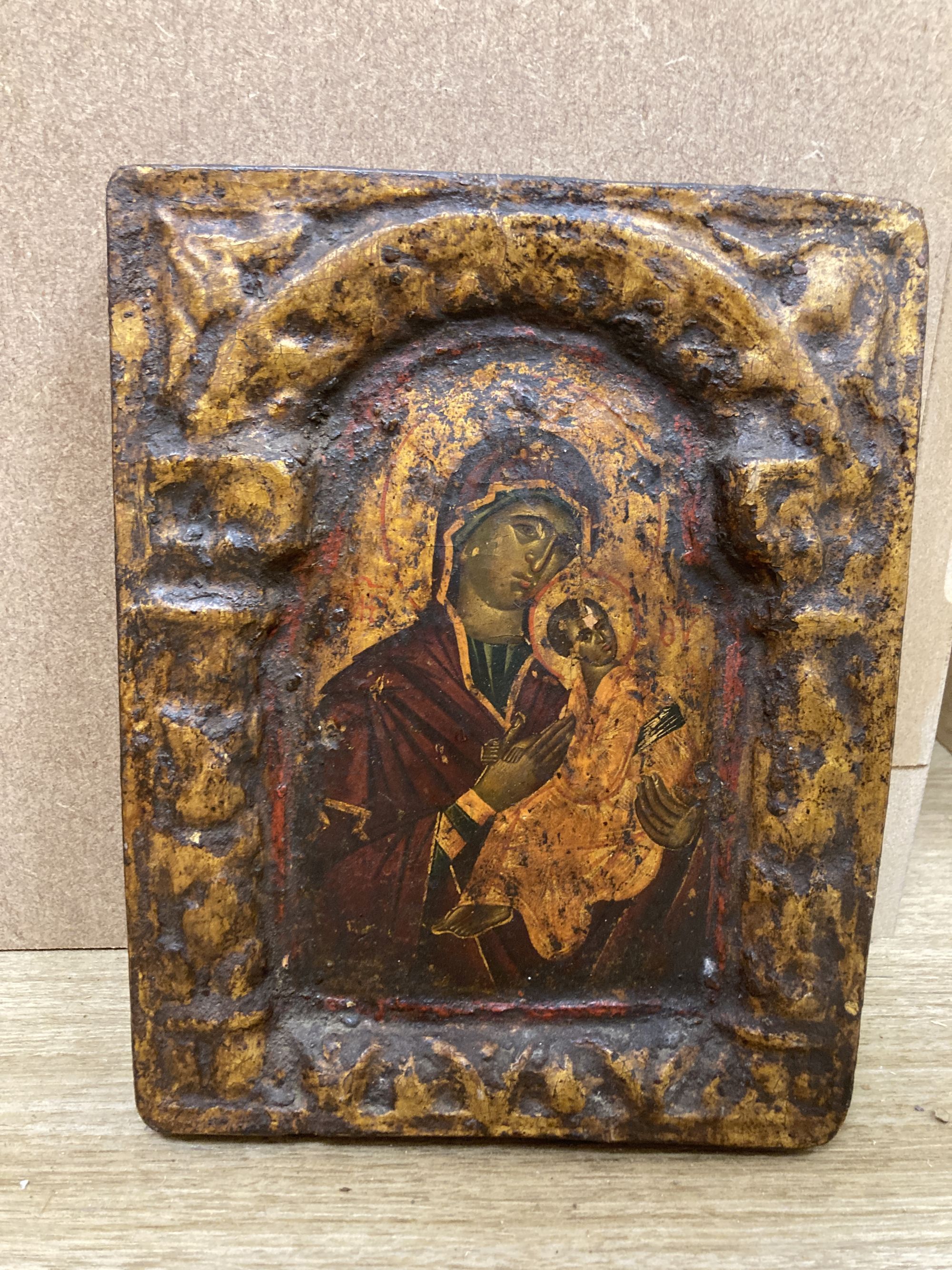 A tempera on wood triptych icon, height overall 25cm and a single Virgin and child icon, 21 x 17cm